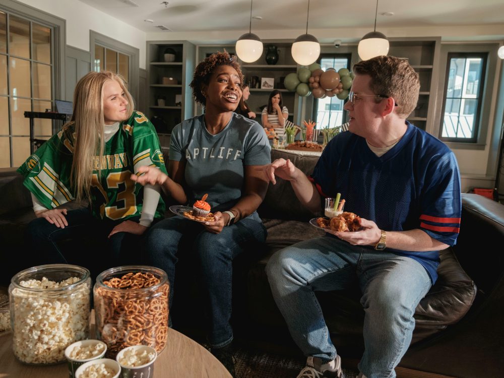 Friends watching live sport together at home with Bunny Stream IPTV